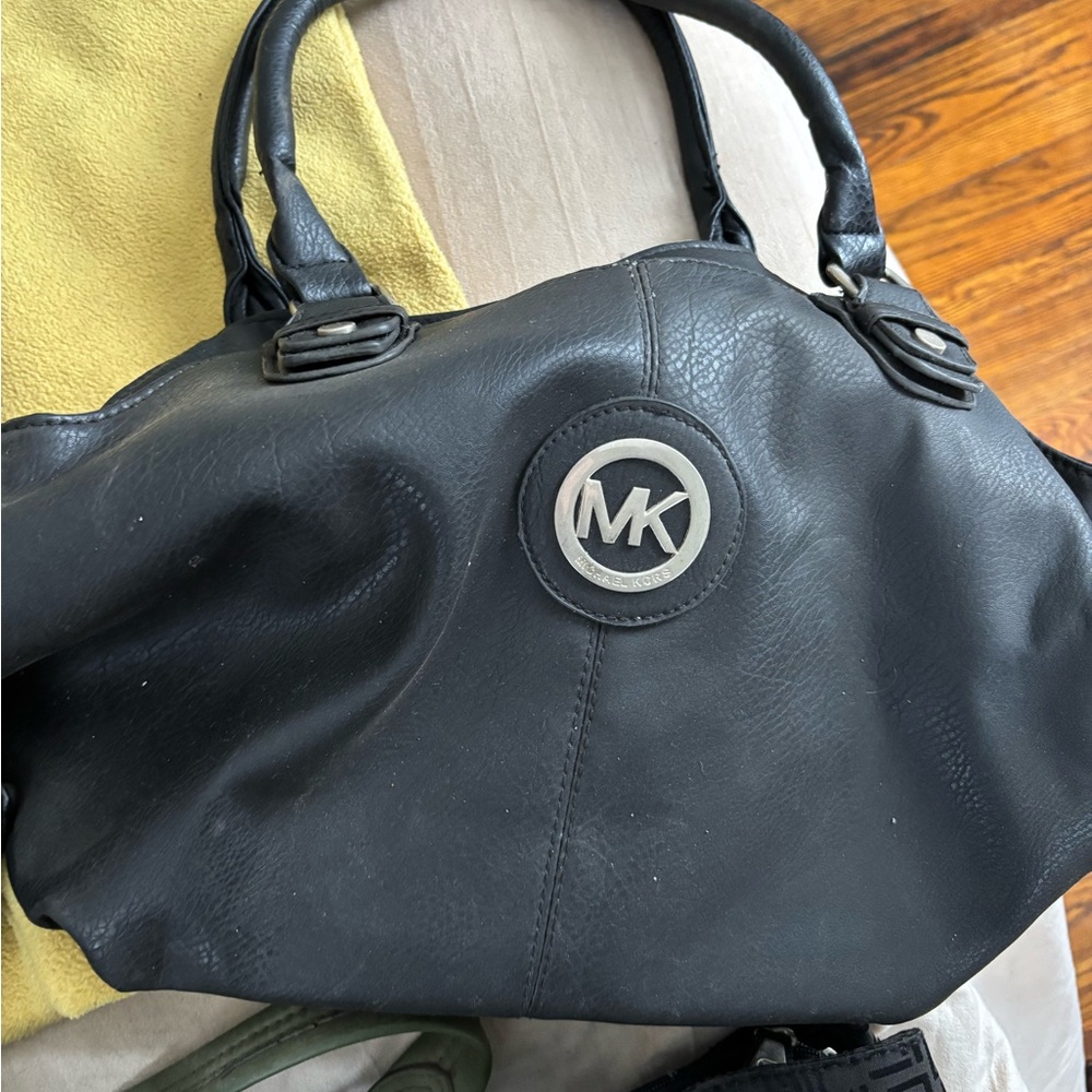 Michael Kors Black Shoulder Bag with Slouchy Shape and Silver Emblem